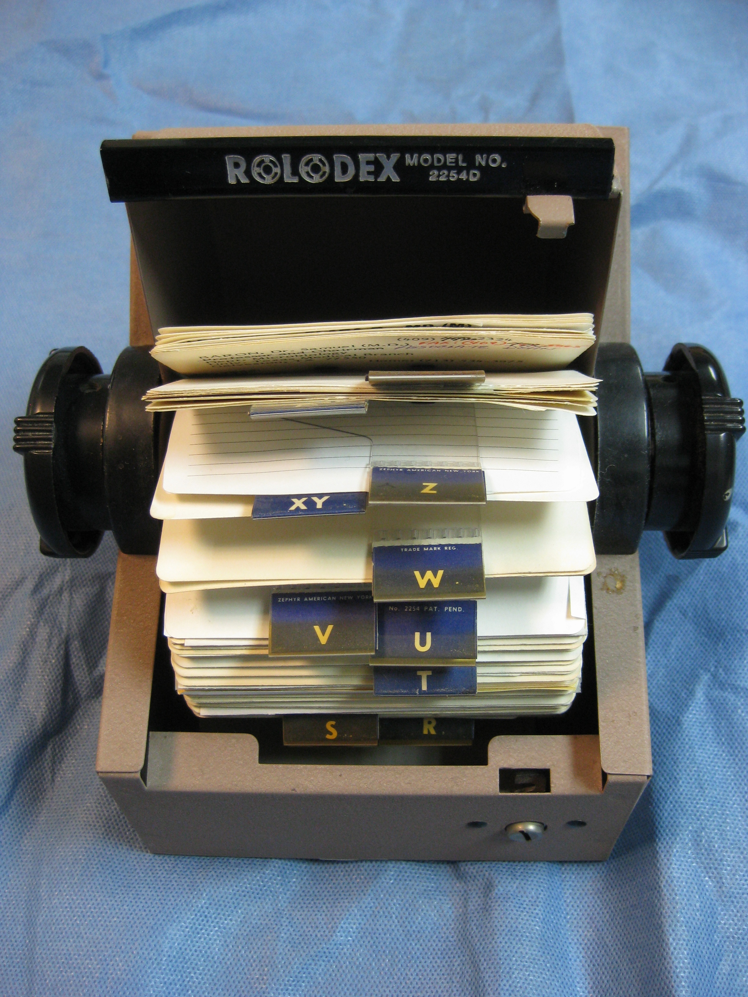 Rolodex jammed with business cards