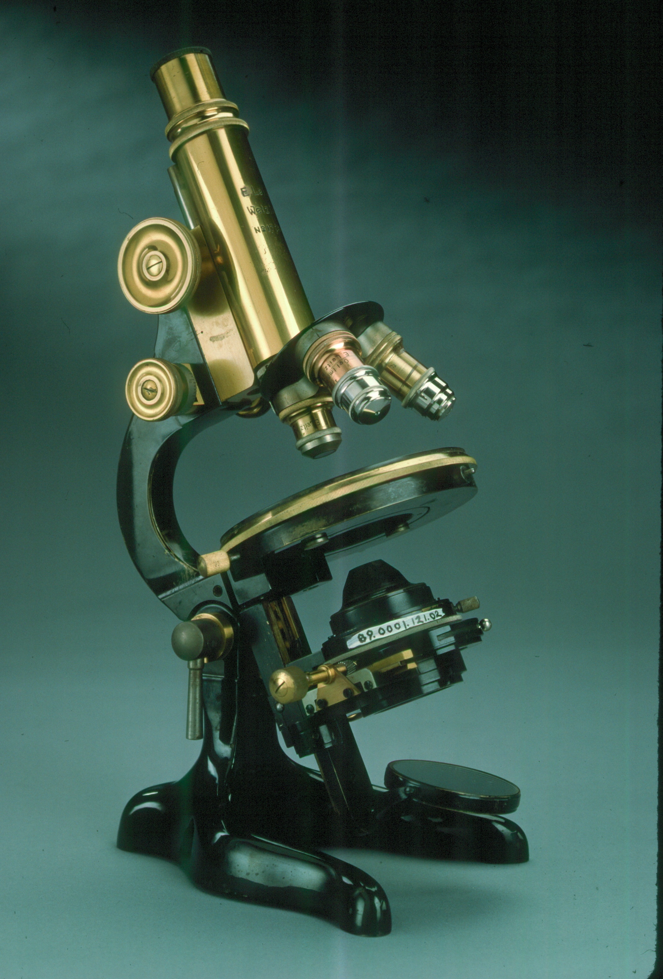 A photo of an antique microscope