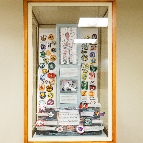 Display case containing many patches