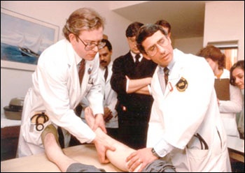 Drs. Lee Hall and Anthony S. Fauci examine participant in an early AIDS study