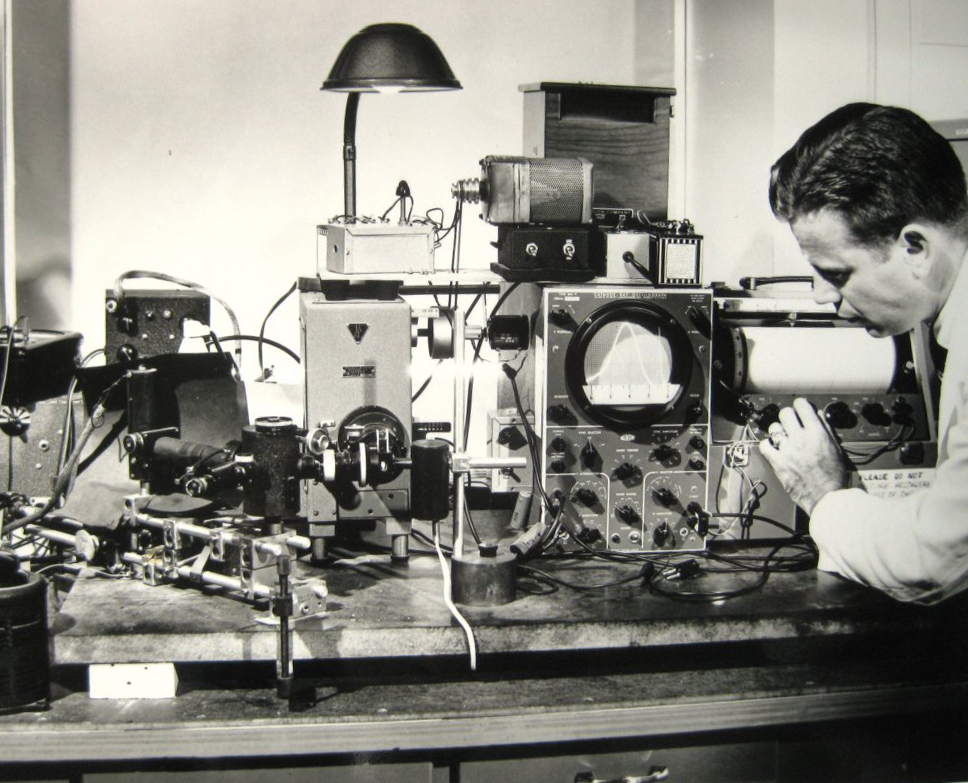 Photo of Dr Bowman in the lab with SPF device
