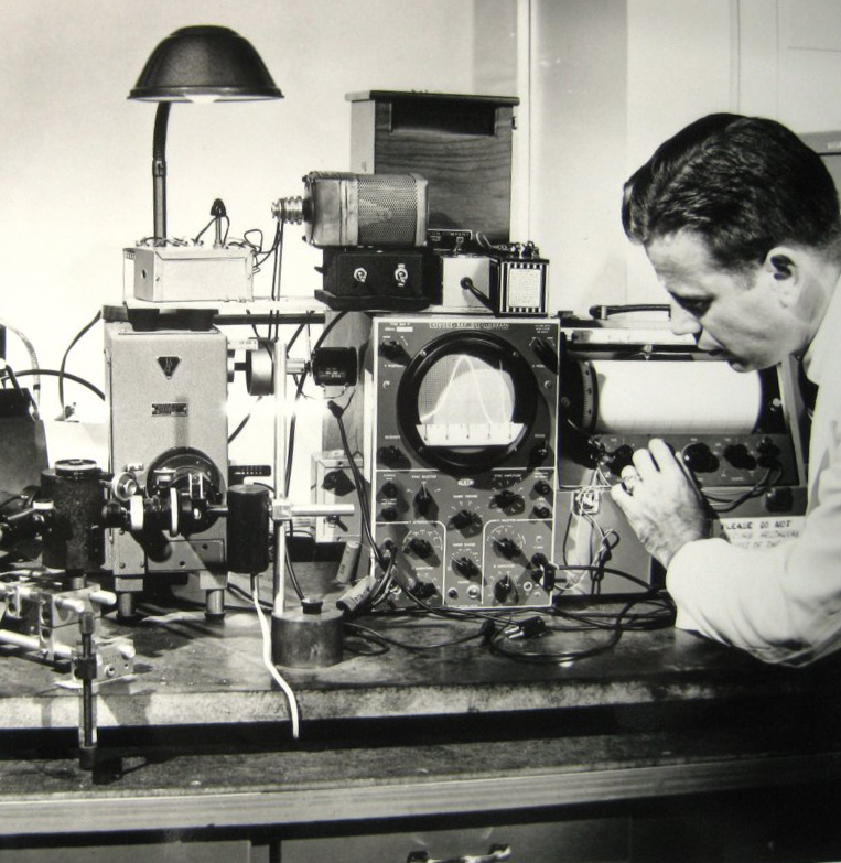 Photo of Dr Bowman in the lab with SPF device