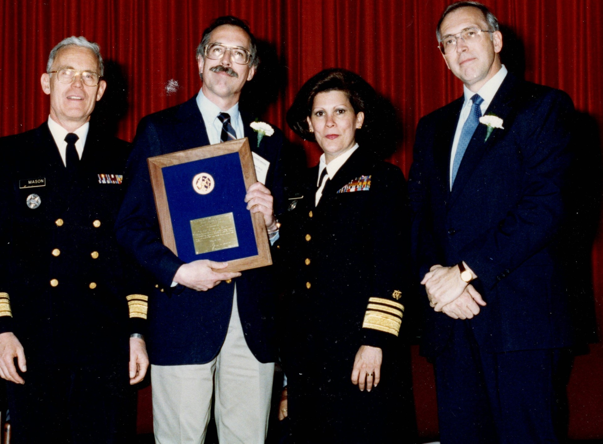 1990 Superior Service Award for AIDS infection model. All are in dress uniforms of the Public Health Service and Kindt holds a citation.