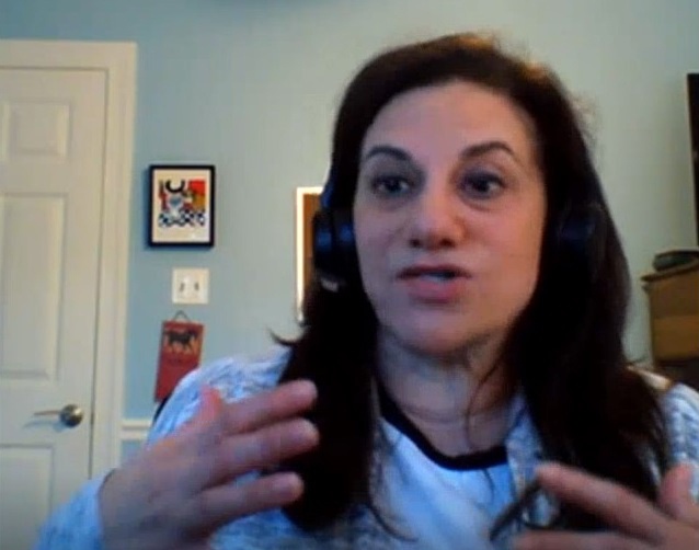 screenshot from video conference showing a woman gesturing with her hands as she speaks
