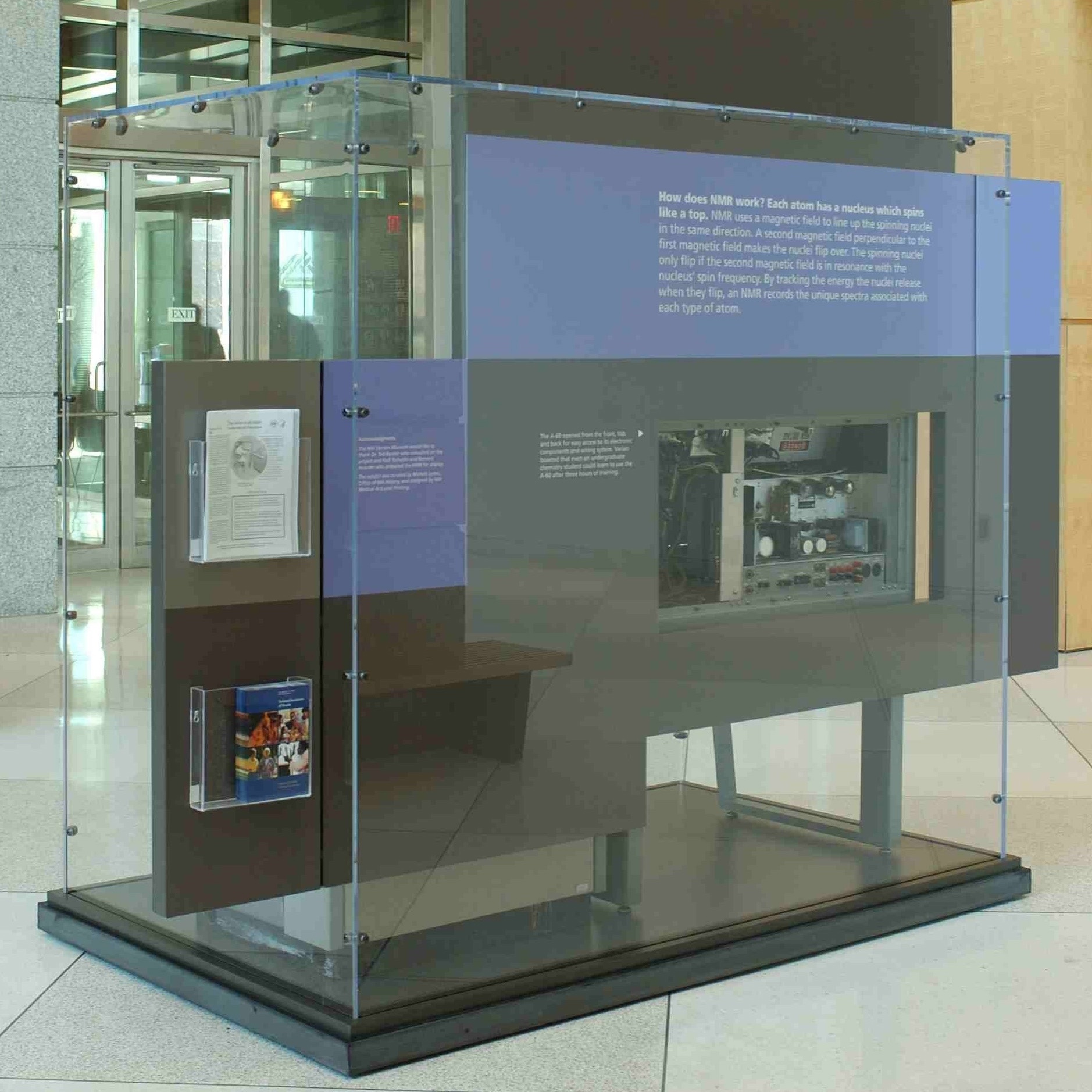 Image of the Varian a-60 microscope on display in the building 60 lobby