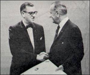 Photograph of Dr. James A. Shannon, NIH Director, 1955 - 1968, receiving the Distinguished Federal Civilian Service Award from President Lyndon B. Johnson in 1966.