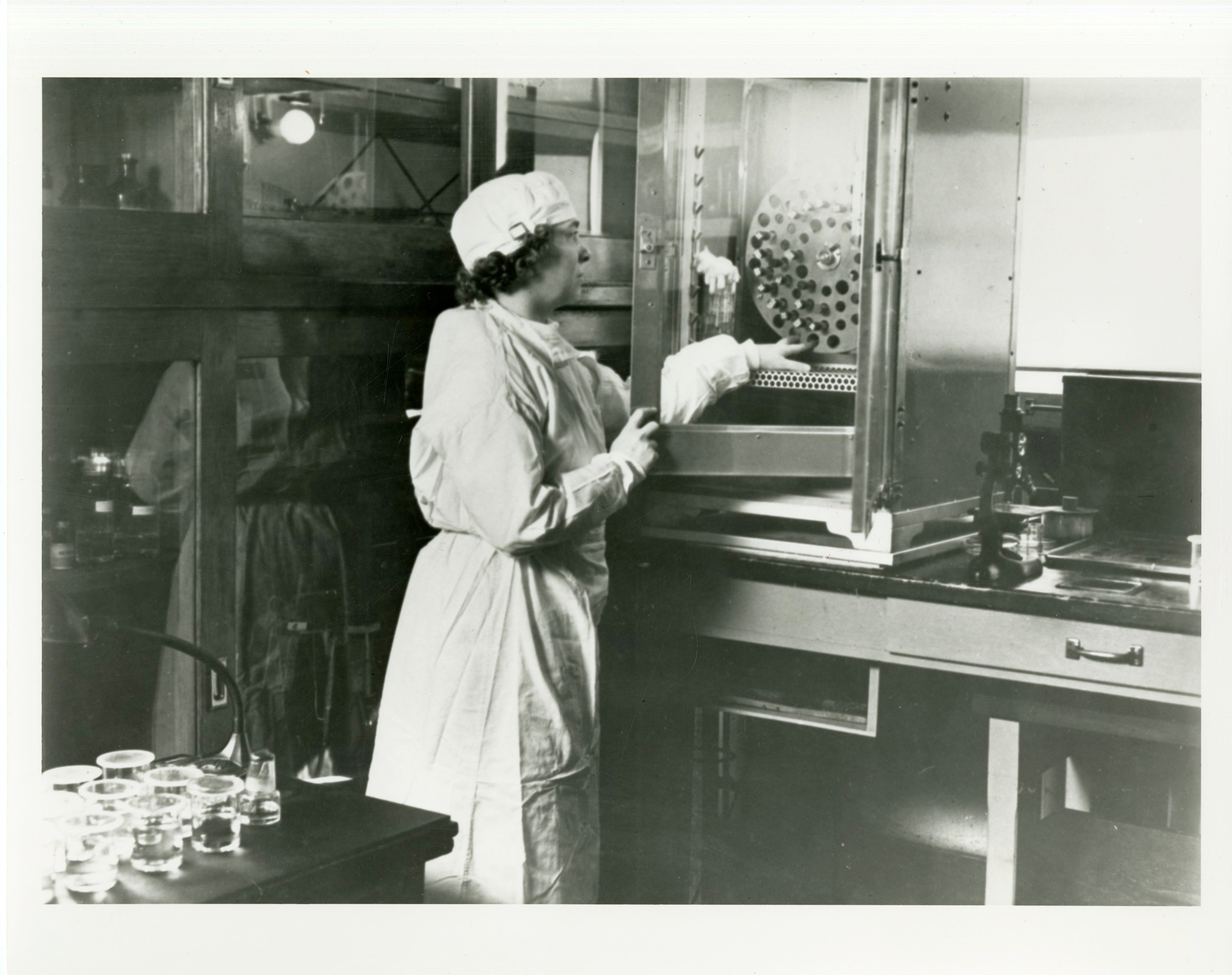 Dr. Emmart using a centrifuge
