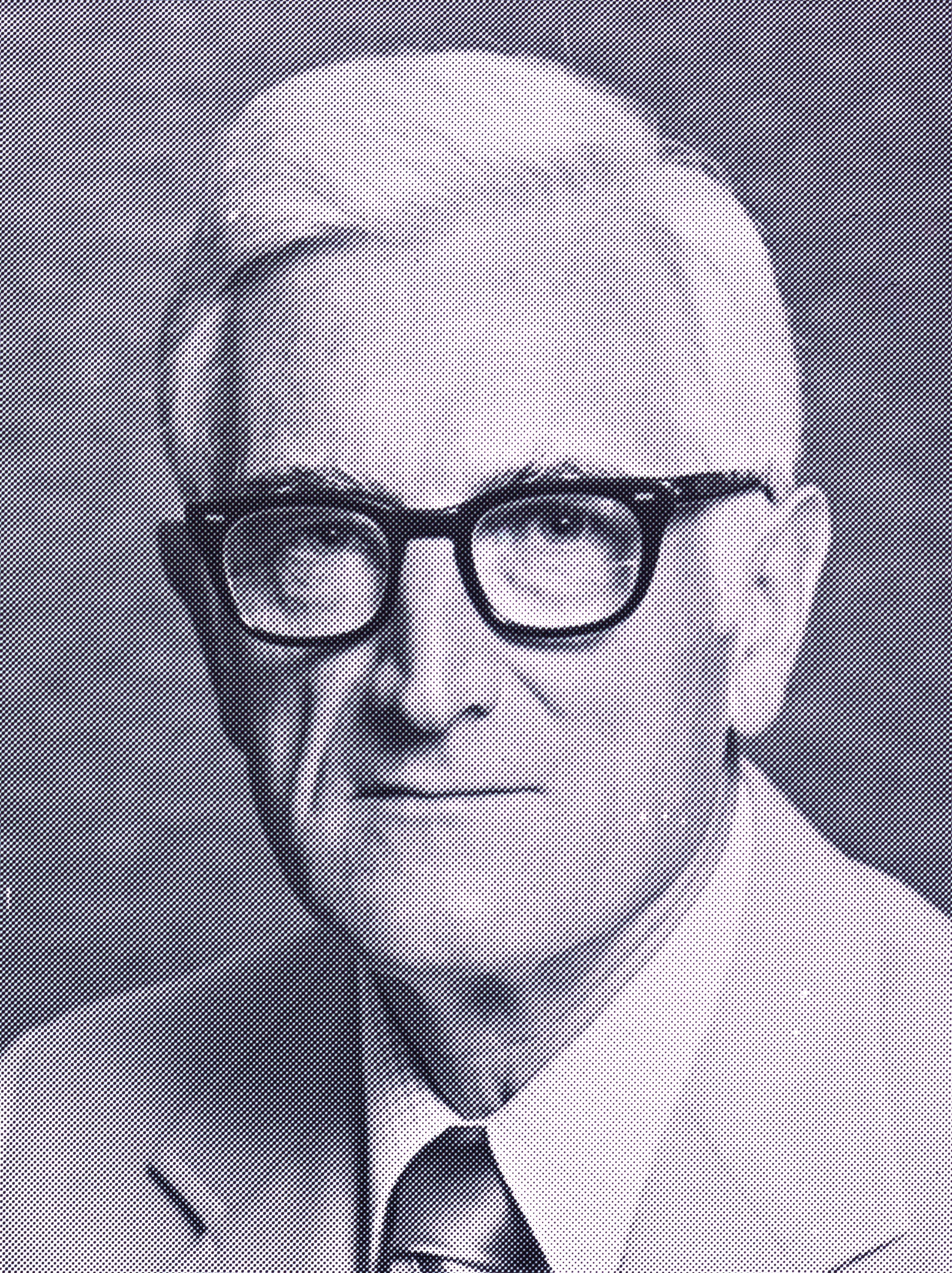 a black and white photo of a man with black glasses wearing a suit and tie