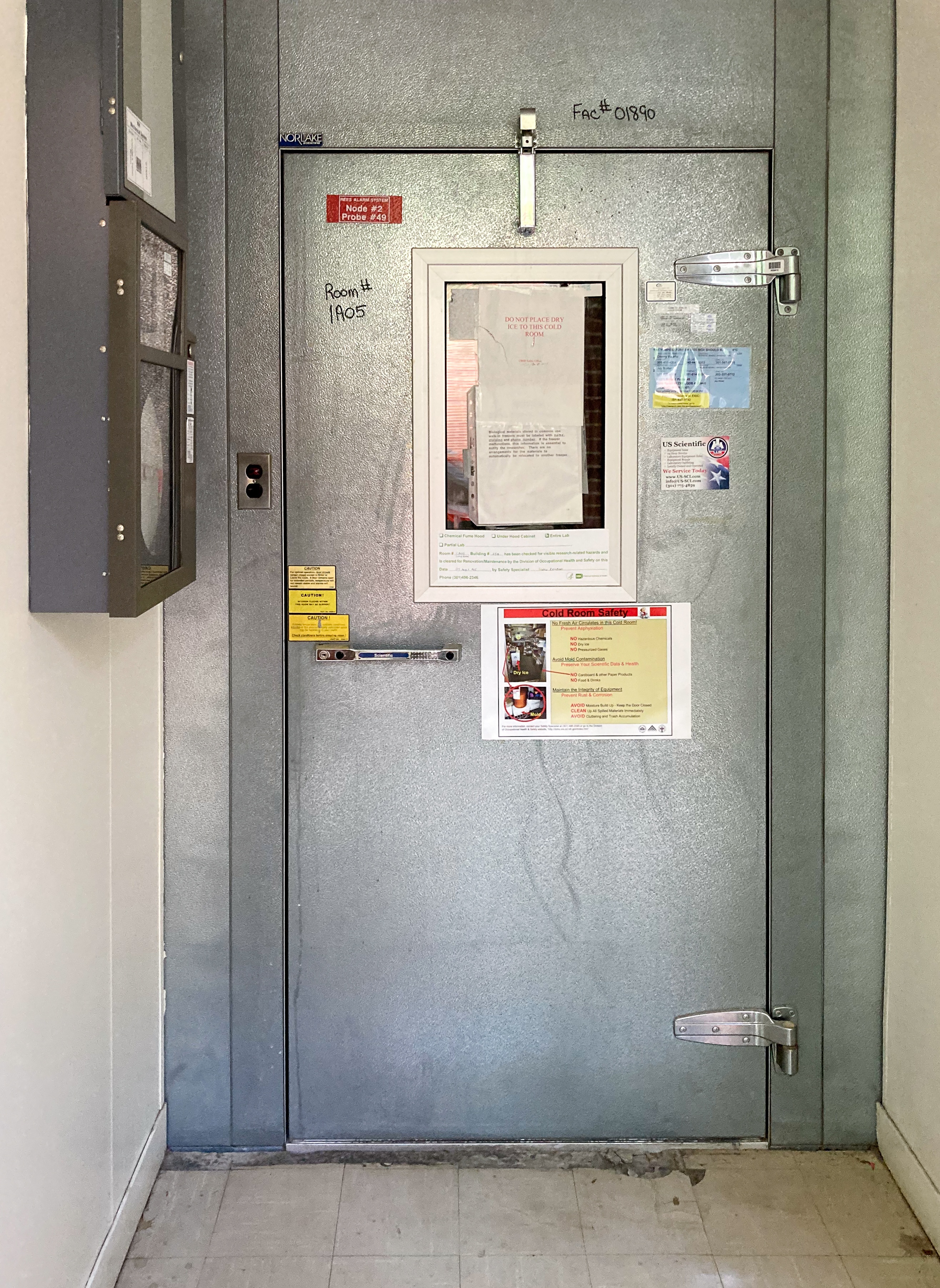 image of a metal door leading to the refrigerated room