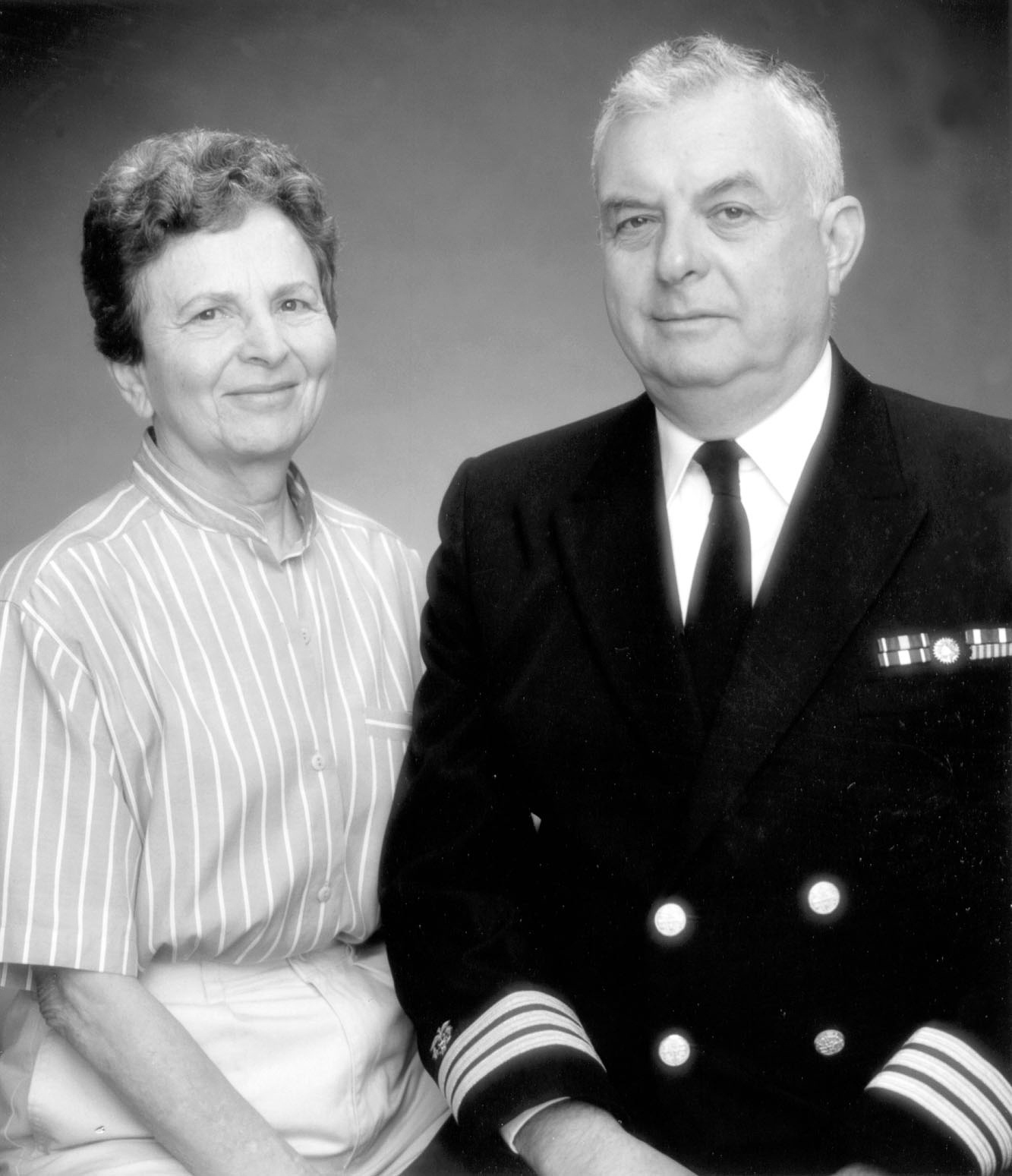 A photo of Dr. Rachel Schneerson and Dr. John Robbins, part of a photo shoot for their Lasker Award. She wears a striped shirt, he wears his Public Health Service uniform