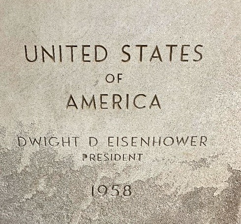 a photo of the limestone cornerstone of Building 29 that reads United States of America Dwight D. Eisenhower President 1958