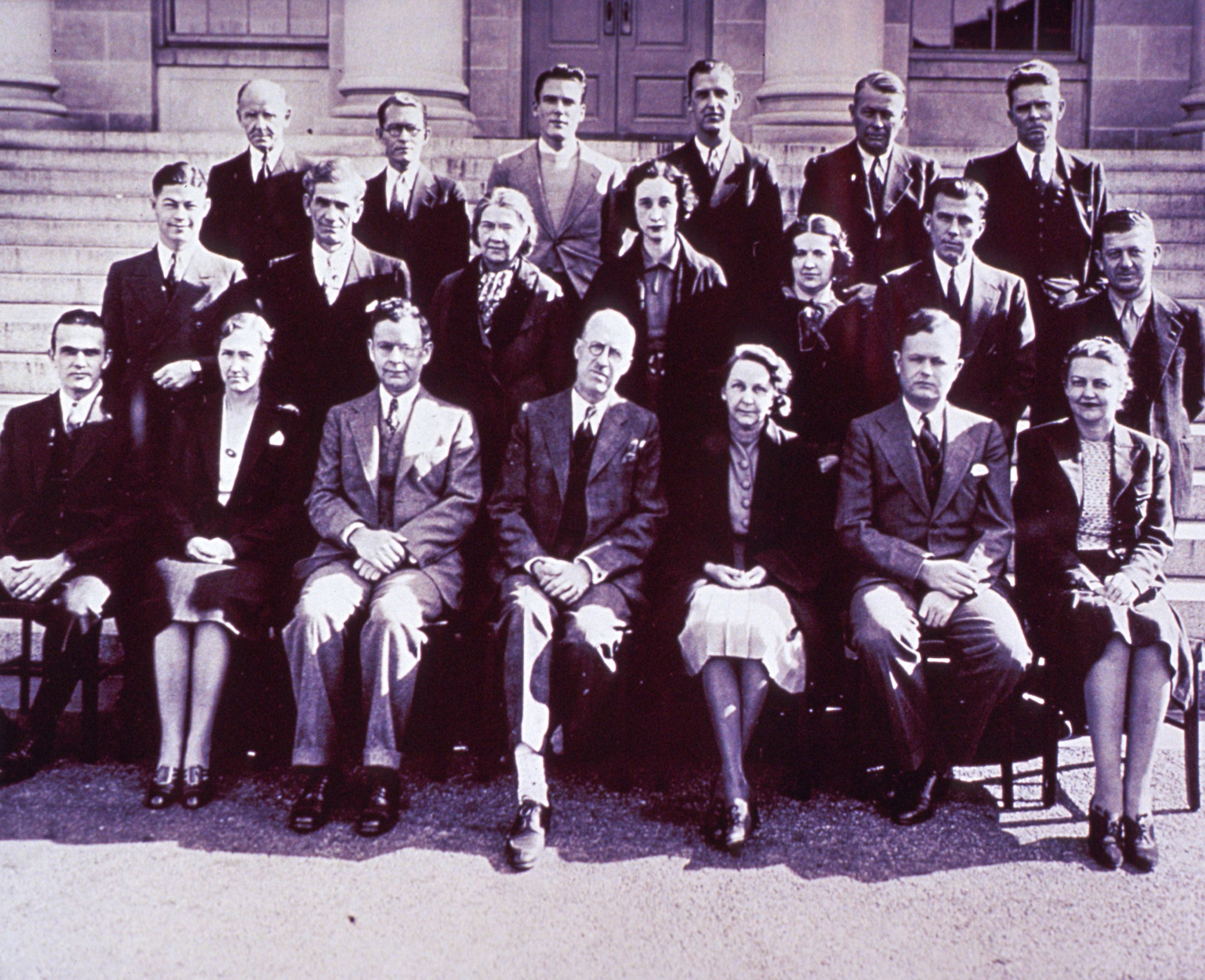a black and white group photo of the biologics staff in the 1930s in front of their Washington DC NIH office building