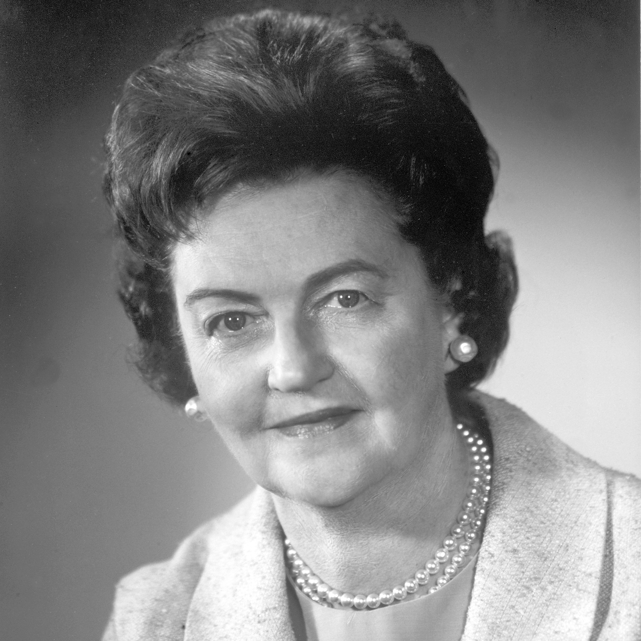 Professional photo of Bernice Eddy in a suit with a pearl necklace