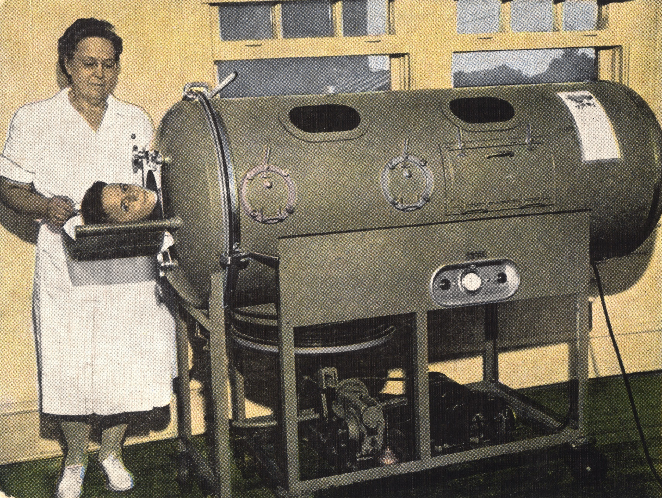 color postcard image circa-1942 with a child in an iron lung being watched over by a nurse.