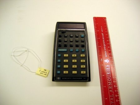 Photograph of a Hewlett Packard calculator with yellow and green buttons