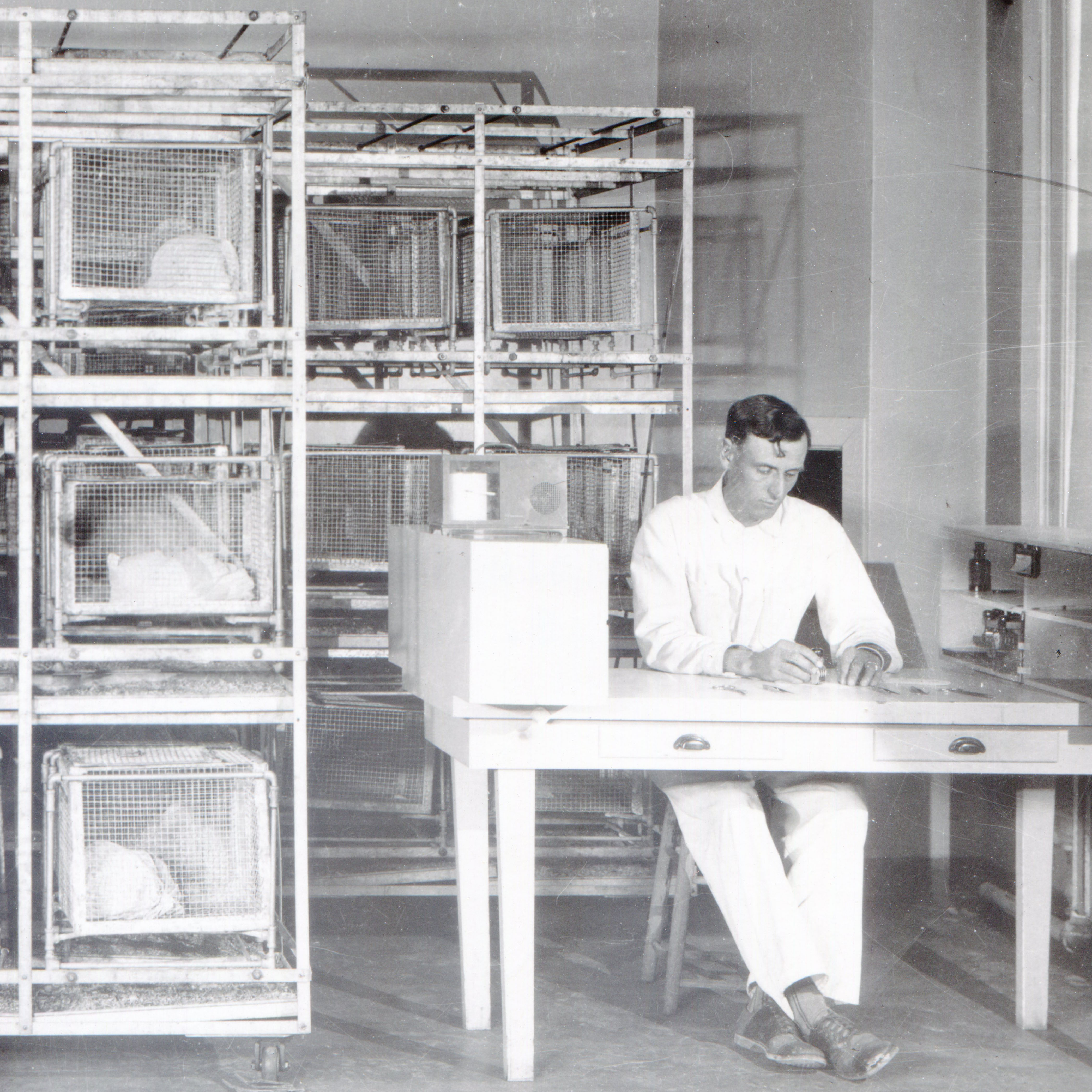 Man sitting in laboratory conducting research.