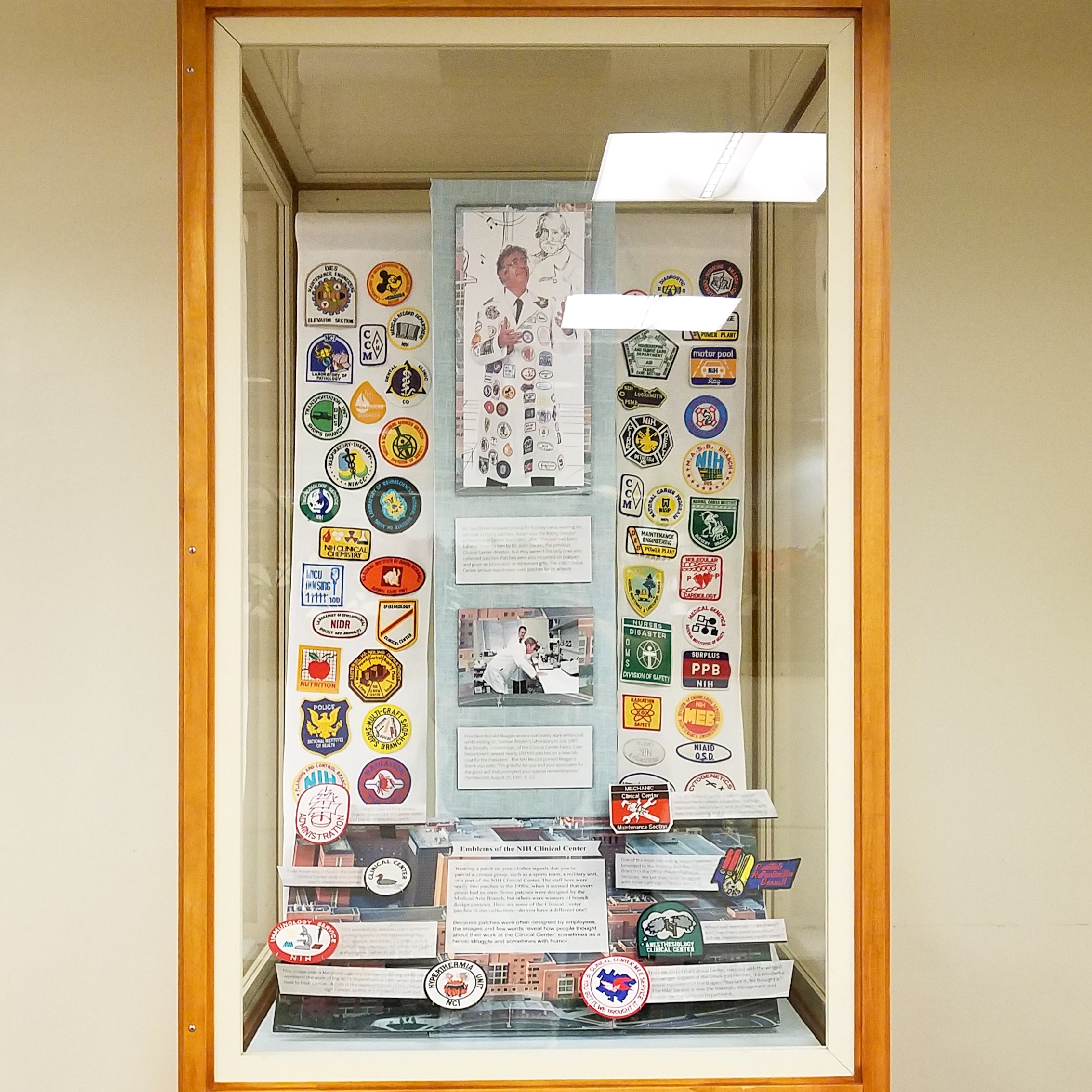 Windowed cabinet full of patches and paper descriptions